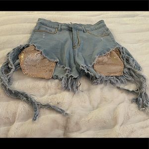 Denim ripped shorts.  Purchased them, but never wore, perfect for a festival!